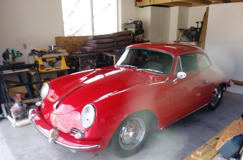 Shiny red classic car in the shop